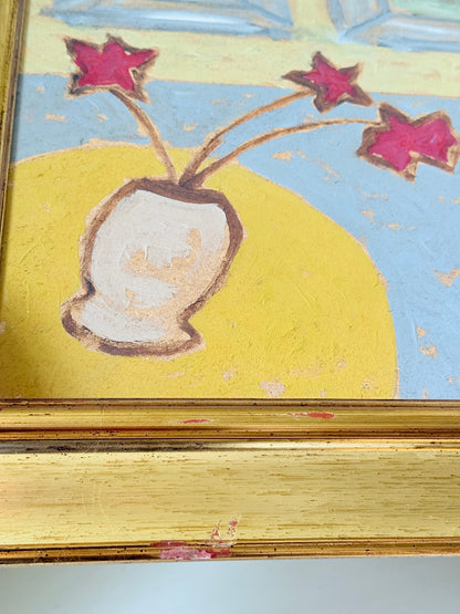 Naïve interior oil painting with red flowers in a vase, in golden frame, styled on a white dresser with neutral background