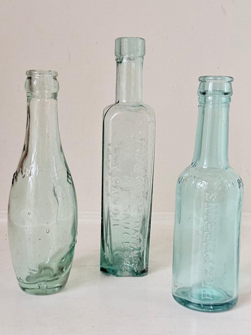 Trio of Antique Aqua Glass Bottles with Embossed Lettering