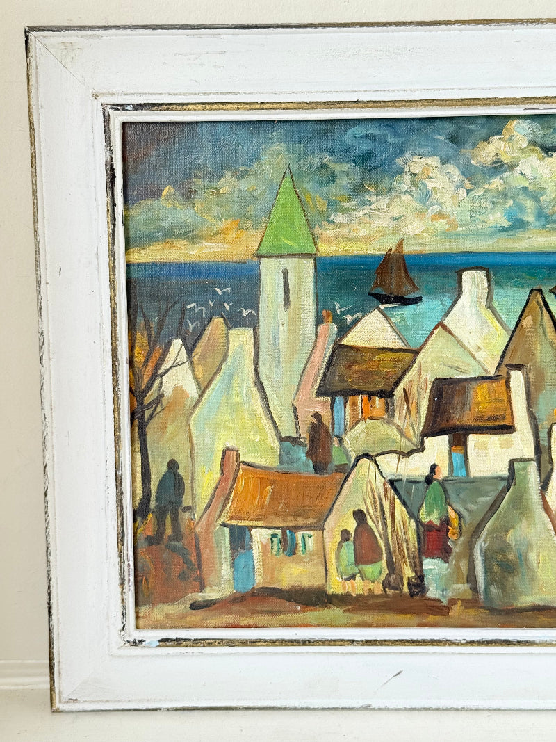 Mid century Irish school oil painting of seaside village, blue and ochre tones, photographed on white surface