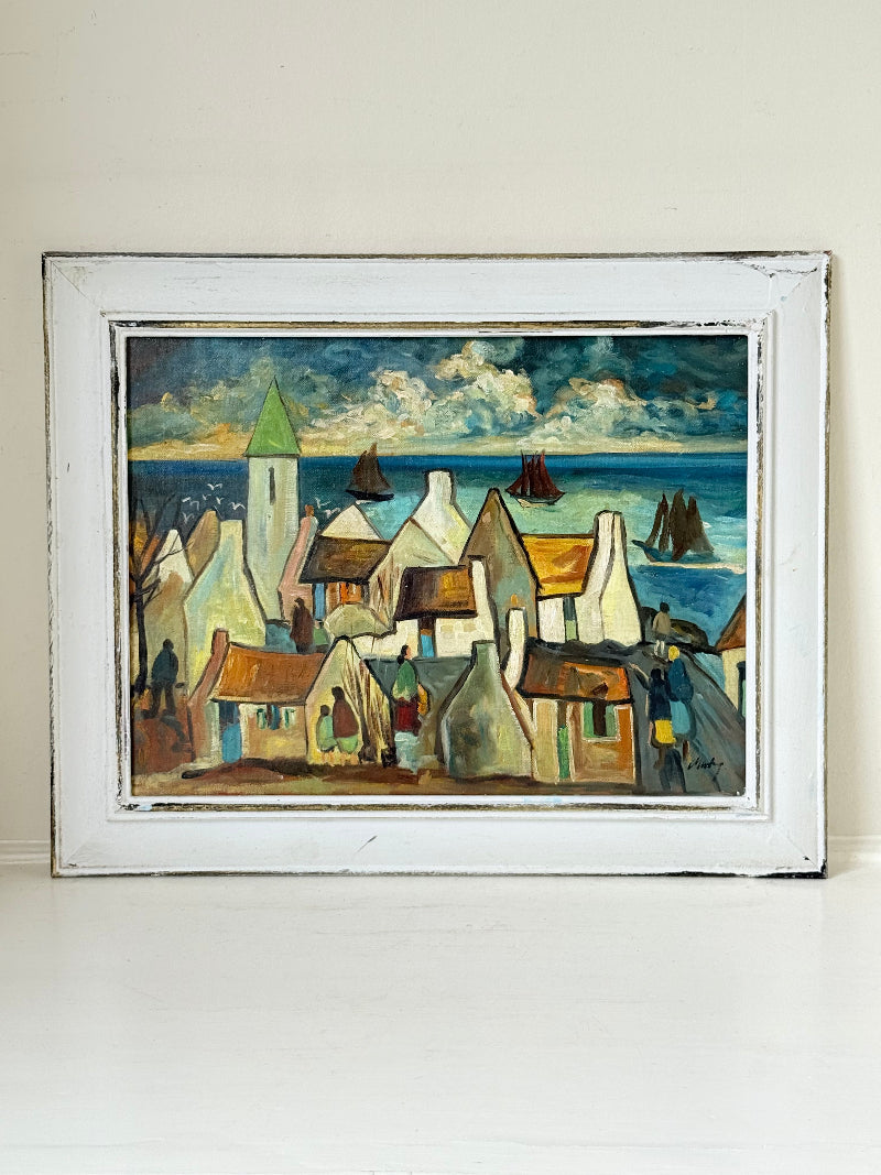 Mid century Irish school oil painting of seaside village, blue and ochre tones, photographed on white surface