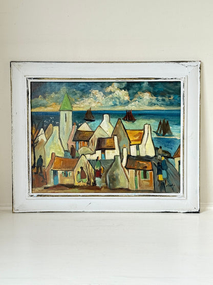 Mid century Irish school oil painting of seaside village, blue and ochre tones, photographed on white surface