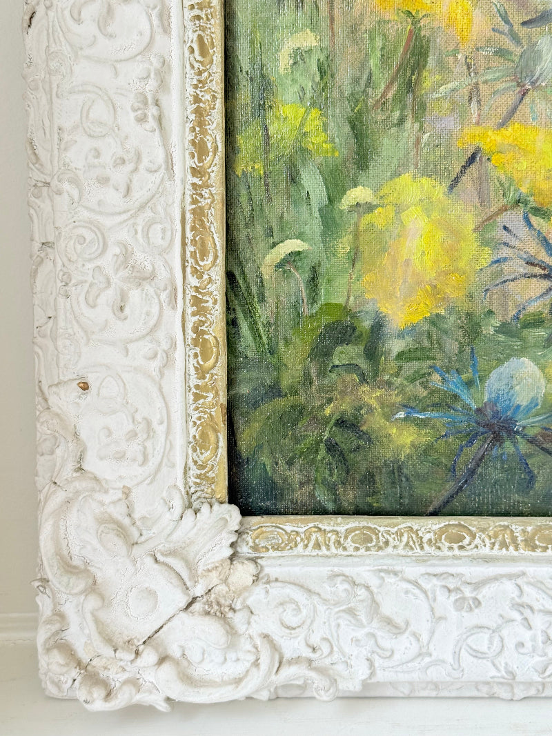 Framed floral oil painting on board by Muriel Hester Broughton, 1970, shown on a white surface with decorative carved frame