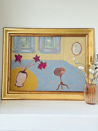 Naïve interior oil painting with red flowers in a vase, in golden frame, styled on a white dresser with neutral background