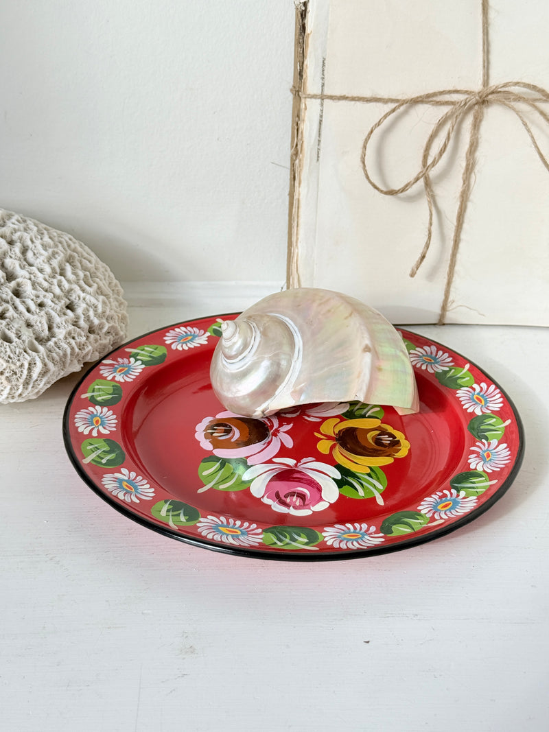 Small chips to the painted roses on a red bargeware enamel plate