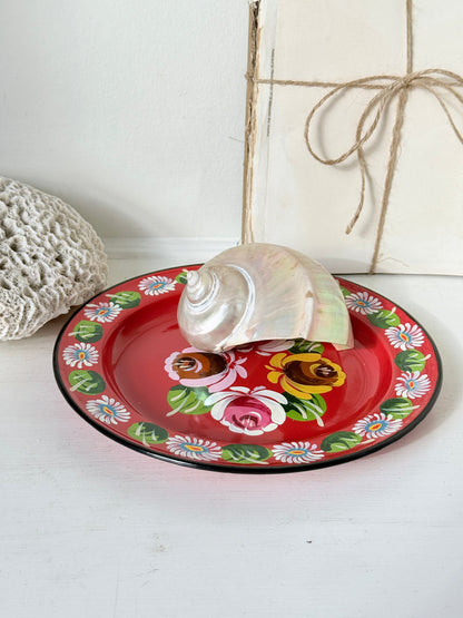 Small chips to the painted roses on a red bargeware enamel plate