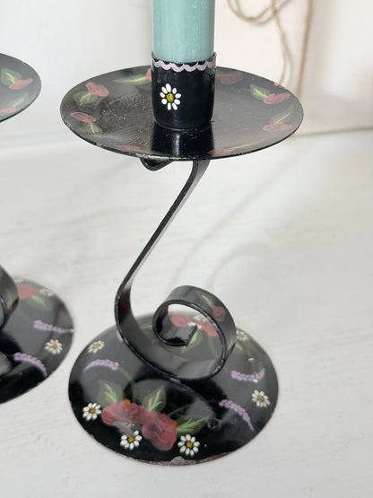 Vintage hand painted black toleware candlesticks with scrolled iron stems