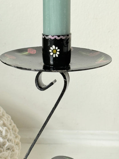 Close up of hand painted daisy on a black toleware candle cup