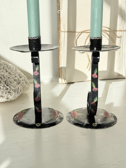 Pair of black folk art candlesticks with hand painted flowers